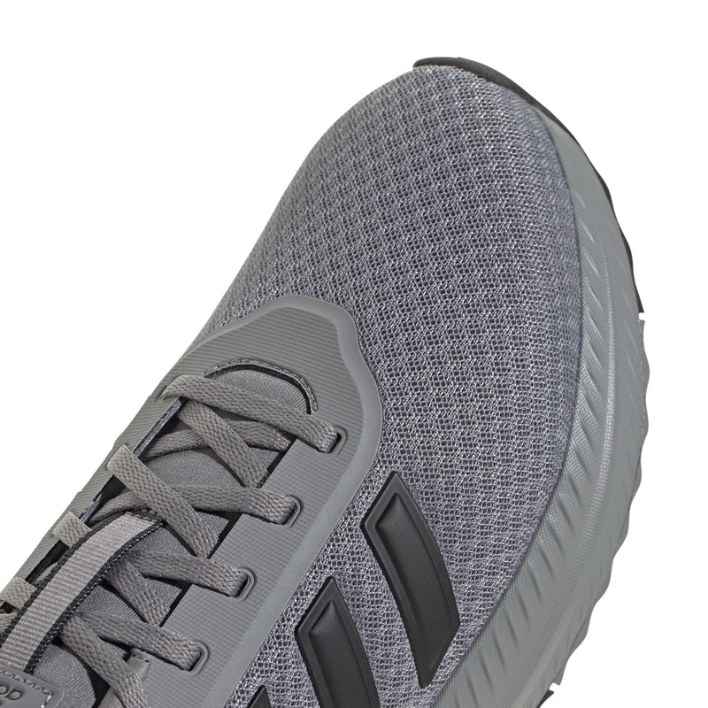 Grey knit side panel of men's running shoe with black stripe detail and grey laces