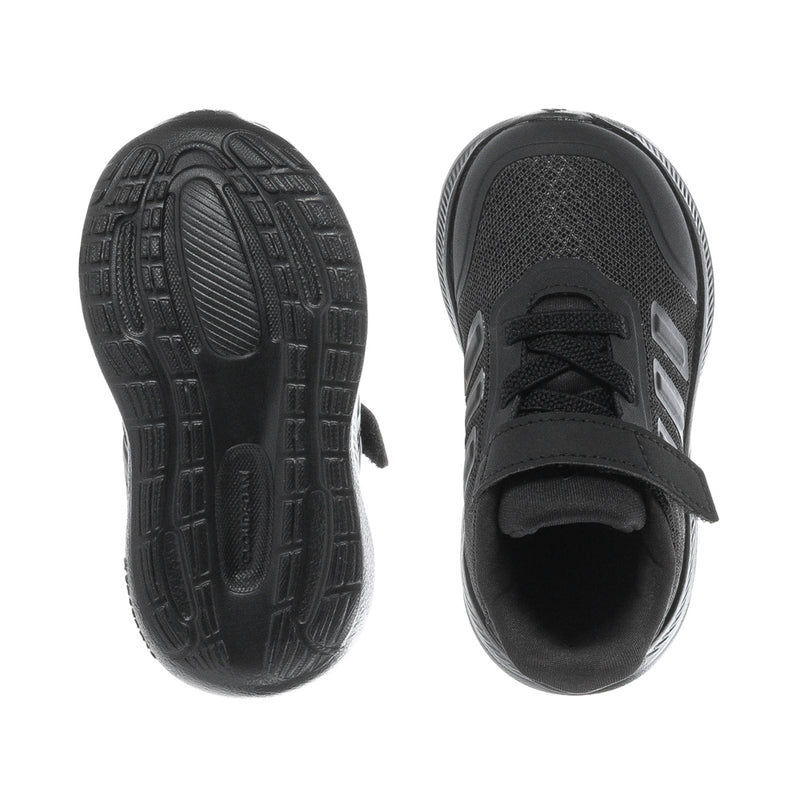 Black toddler sneakers showing treaded outsole and open interior view