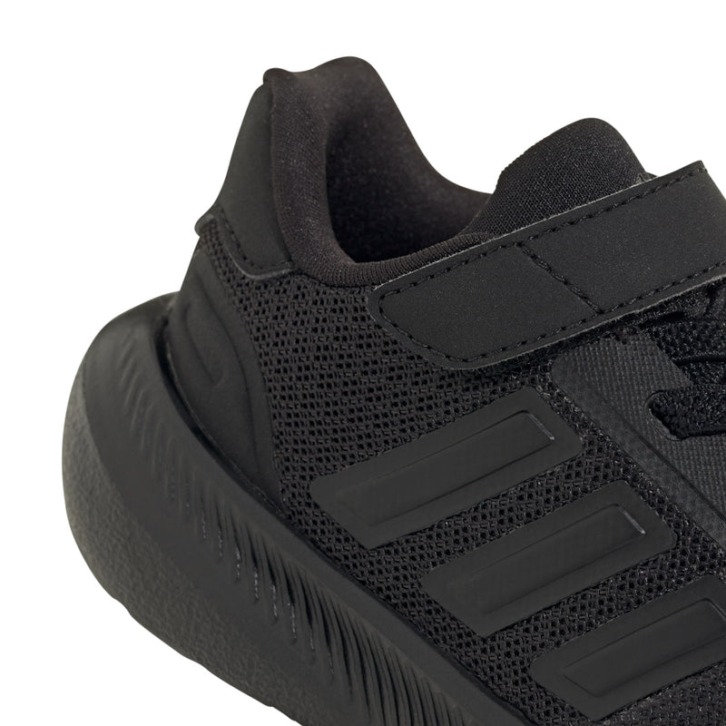 Black toddler sneaker close-up of mesh upper, stitched strap, and three stripe logo