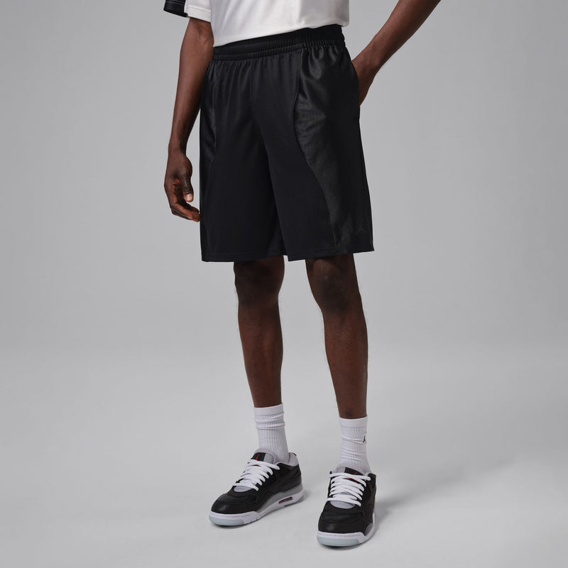 Men's black athletic shorts with elastic waistband and side pockets at mid-thigh