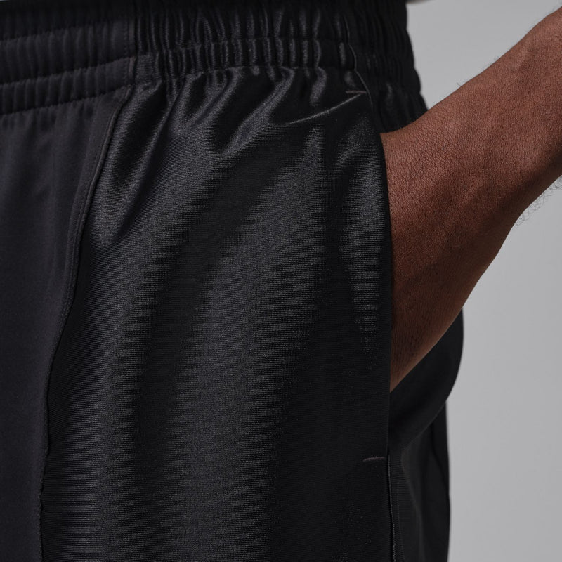 Black athletic shorts with textured fabric and elastic waistband