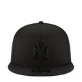 Black baseball cap with raised NY logo on the front and curved brim