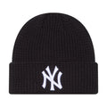 Navy knit waffle beanie with white NY logo patch at cuff