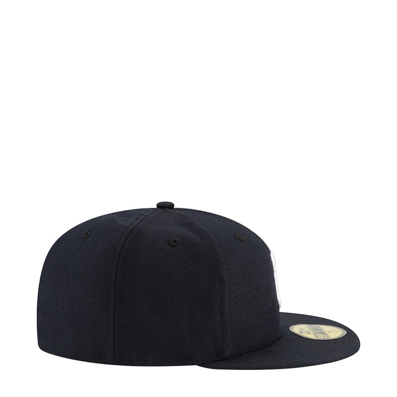 Dark baseball cap side view with curved brim and small ventilation eyelets