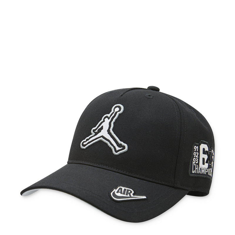 Youth Jordan black curved brim cap with white Jumpman logo and Air label