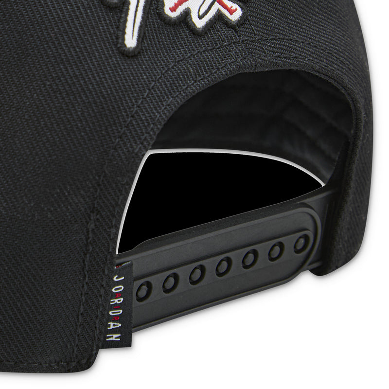 Youth Jordan black cap close-up of snapback strap and perforated side panel