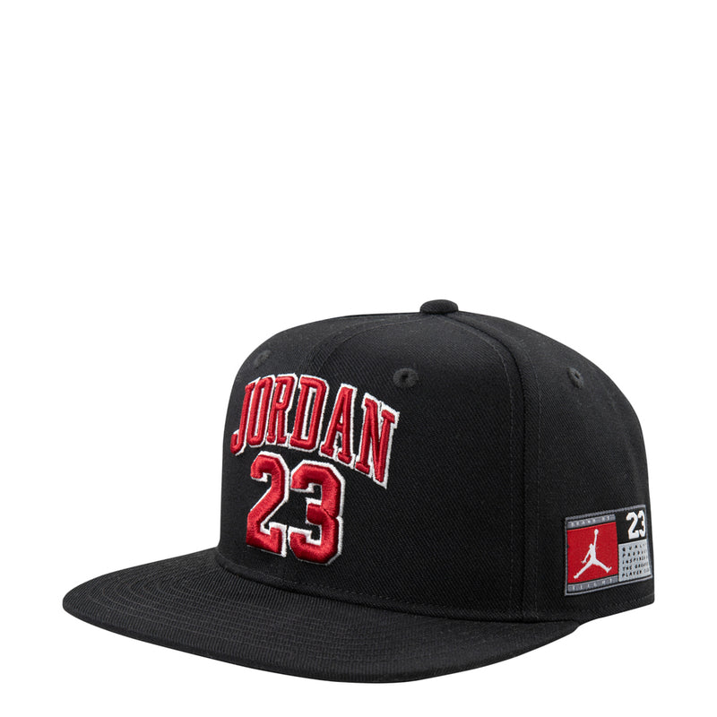 Black youth snapback cap with red 'JORDAN 23' front logo patch