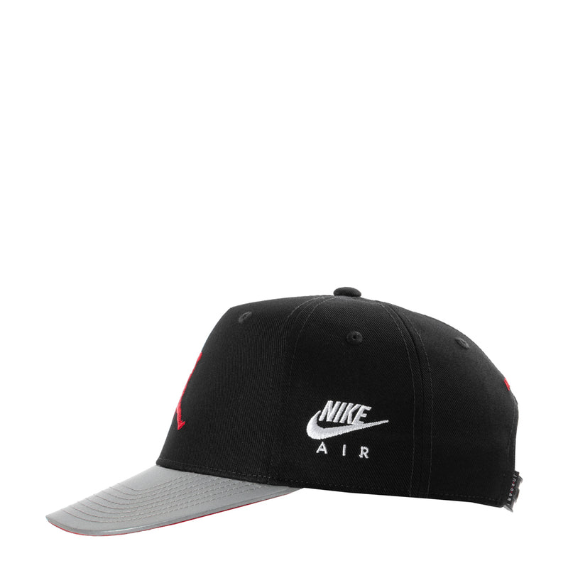 Youth snapback cap, black crown with white NIKE AIR logo and gray brim