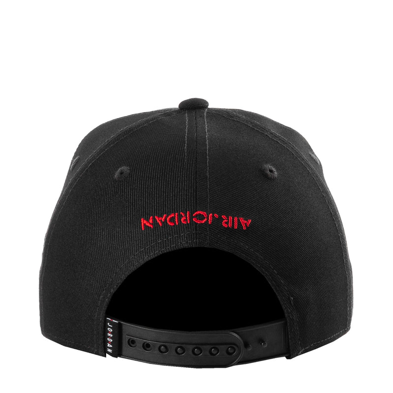 Youth snapback cap, black front panel with red embroidered script and snapback strap