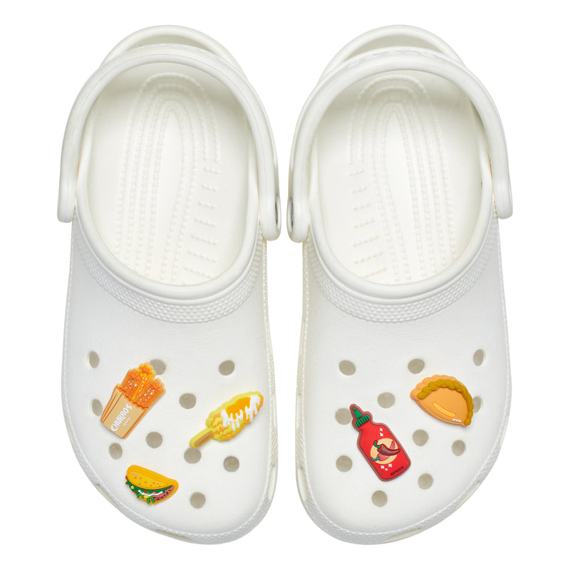 Food Jibbitz charms on white clogs: taco, bottle, corndog, fries, popsicle