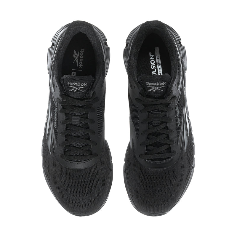 Men's black lace-up shoes with Reebok branding inside tongue and padded collar