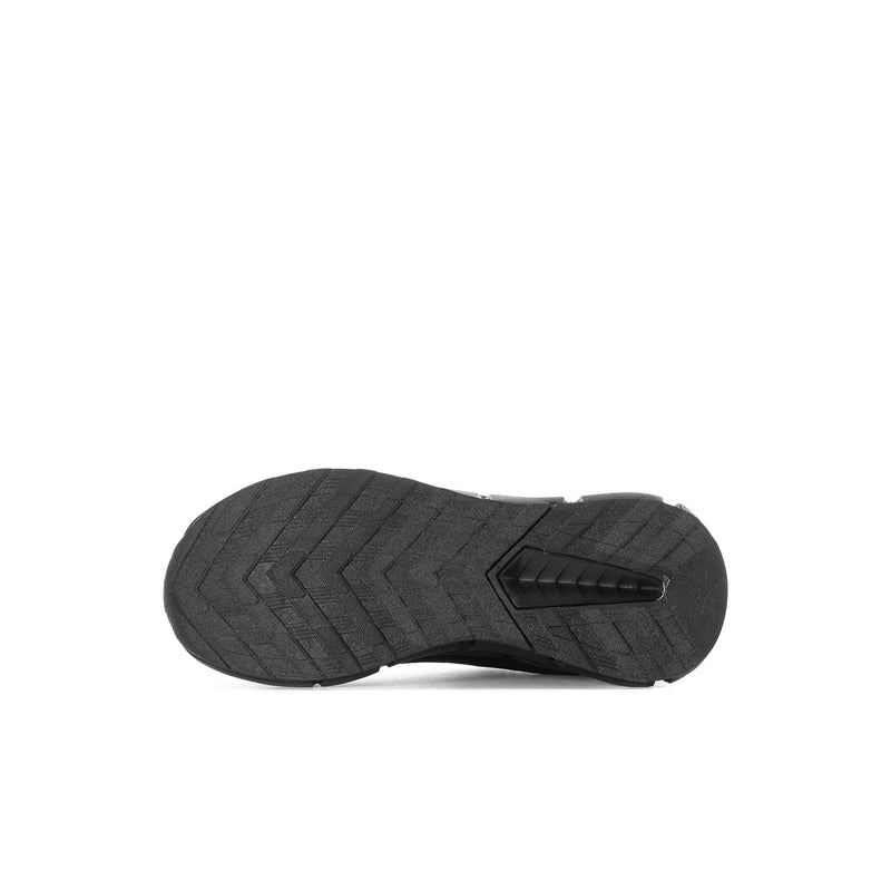 Black kids sneaker outsole with zigzag tread pattern and rubber traction