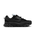 Women’s black trail running shoes with blue accent laces and chunky rubber sole